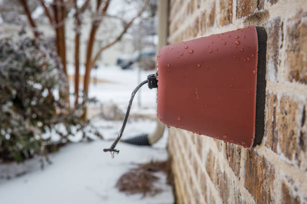 Outdoor faucet cover in the winter with icicles on it Outdoor faucet cover in the winter with icicles on it frozen water stock pictures, royalty-free photos & images