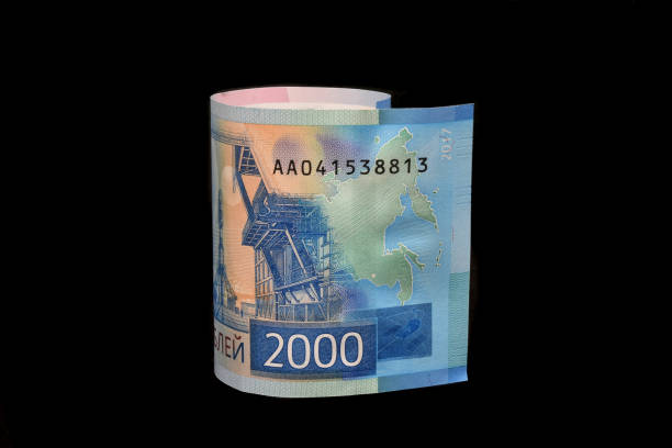 istock 2000 ruble bills isolated on black background. New Russian banknotes two thousand rubles. Rubles growing up. Strong ruble. 1303206721