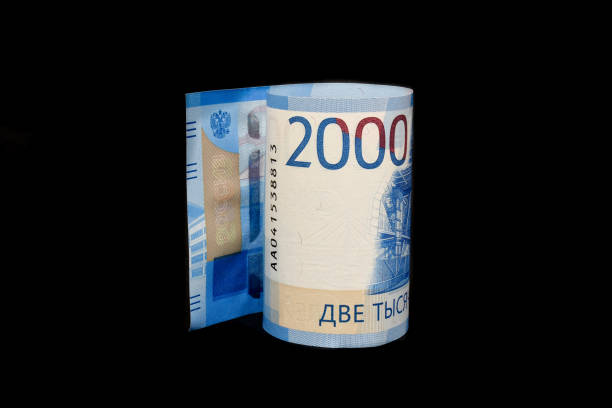 istock 2000 ruble bills isolated on black background. New Russian banknotes two thousand rubles. Rubles growing up. Strong ruble. 1303206737