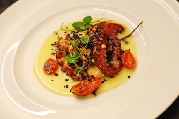 istock Cucina italiana tipica - Puglia - octopus with chickpea cream 1303206876