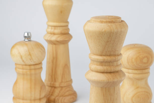 istock Wooden mills with salt and pepper on white 1303210013