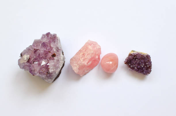 istock Gems lying on the table. Amethyst  crystals and rose quartz. 1303216159