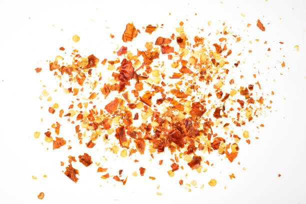 istock Red chili flakes isolated on white background with clipping path 1303216941