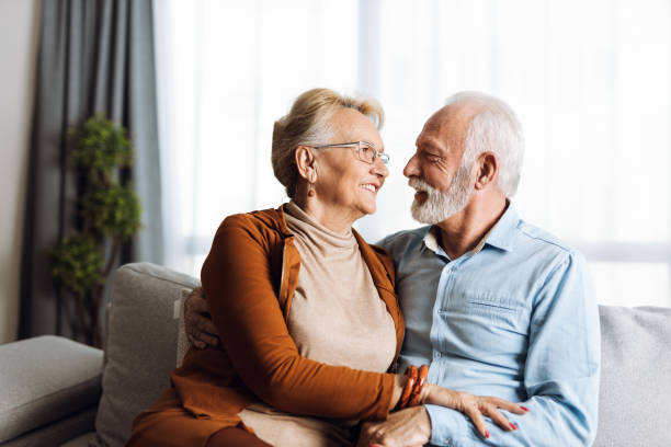 istock Senior couple talking to each other at home 1303217843