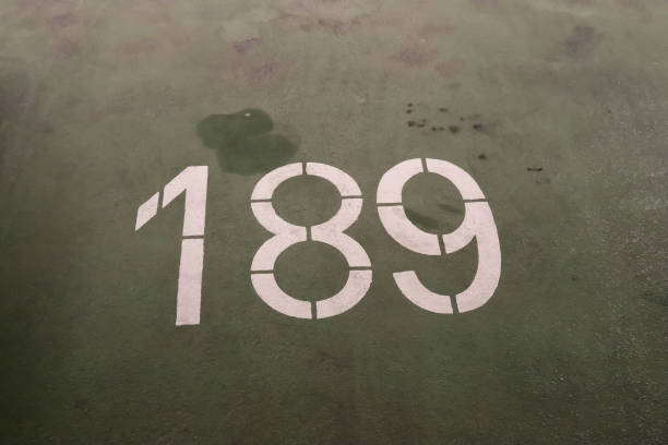 Numbers painted on concrete and asphalt surfaces