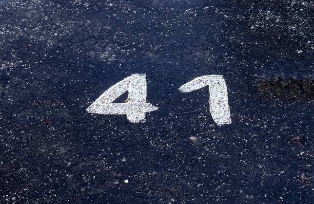 istock Numbers painted on concrete and asphalt surfaces 1303225580