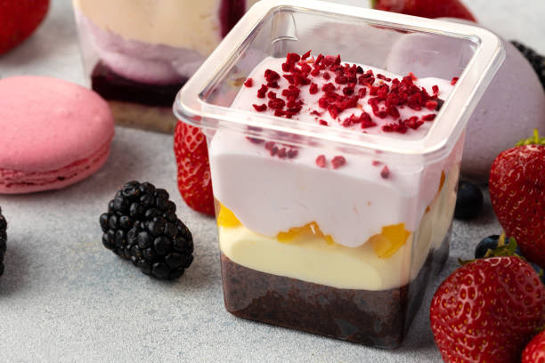 istock Mousse dessert with berry topping on grey surface 1303227042