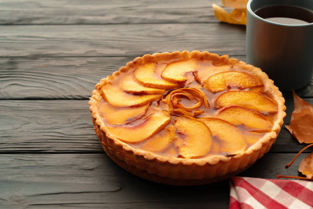 istock Apple tart pie for Thanksgiving celebration on wooden table 1303227157