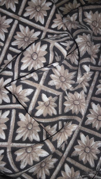 istock Beige and brown floral fabric 1303235570