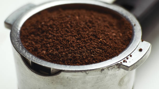 istock Portafilter with ground coffee. Coffee filter holder. Macro, close-up 1303235635