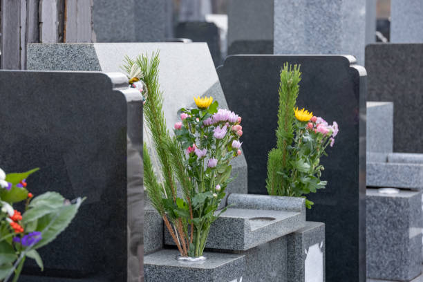 istock Incense sticks and flowers offered to the grave 1303236397