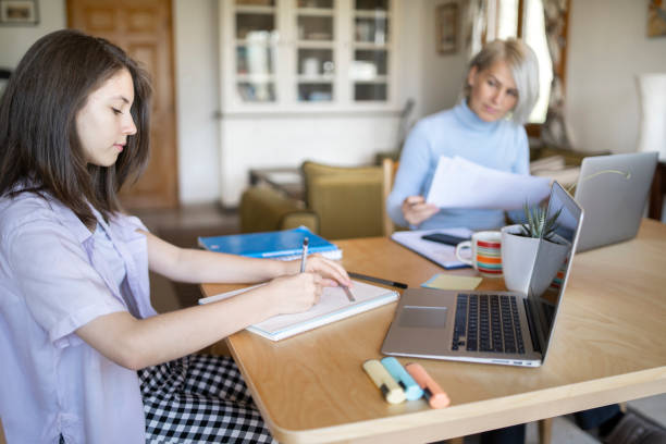 istock Young teen studying online from home 1303237158