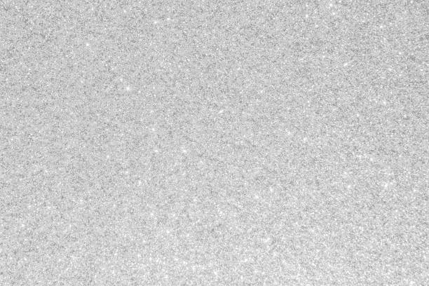 istock Silver glitter background texture white sparkling shiny wrapping paper for Christmas holiday seasonal wallpaper decoration, greeting and wedding invitation card design element 1303237367