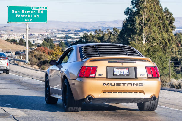 Nov 27, 2020 San Ramon / CA / USA - Ford Mustang GT old model, driving on the freeway in San Francisco Bay Area
