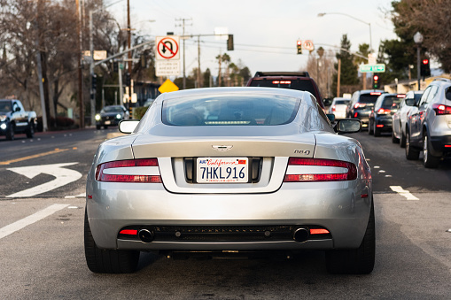 Jan 15, 2021 Concord / CA / USA - Rear view of Aston Martin DB9 waiting at a traffic light in East San Francisco Bay Area
