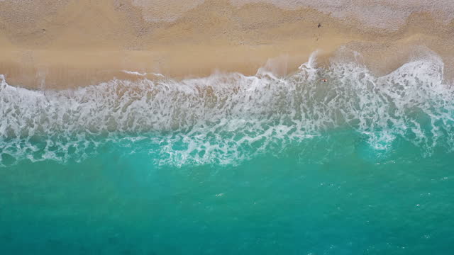 Aerial view of clear sea and beach. Antalya, Turkey. Taken via drone. 4k video.