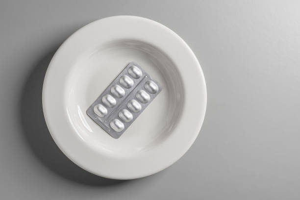 istock Silver Color Medicine Package In White Plate. 1303241669