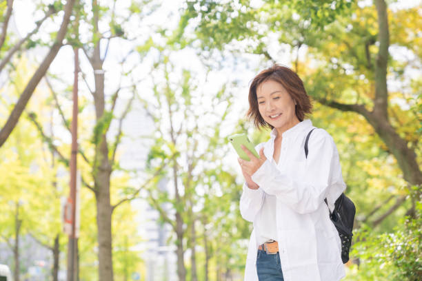 istock senior age woman who uses smart phone 1303242082