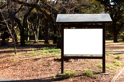 Blank Japanese style wooden bulletin board in the park.