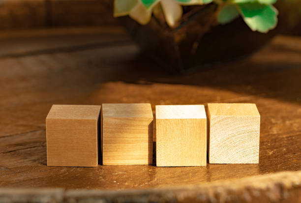 groupped wooden square blocks on dark wooden table - groupped imagens e fotografias de stock