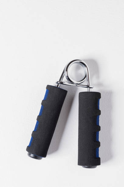 istock Hand Grip Fitness Trainer. Hand Grip Exercise Spring 1303246756