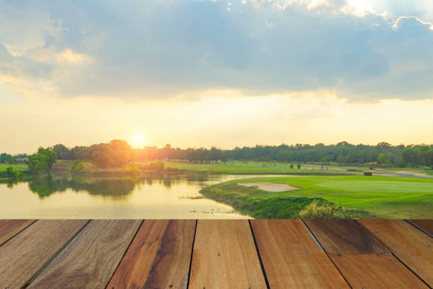 istock Wooden floor and golf course background. 1303247682