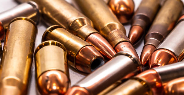 istock Different types of bullets laying on a white background 1303248412