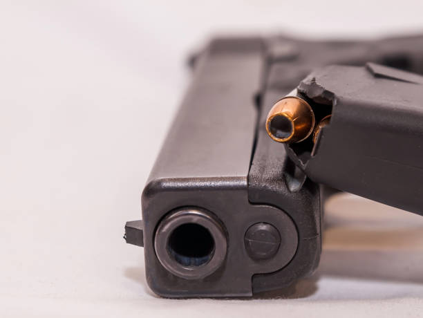 istock A black pistol with a loaded magazine 1303248426