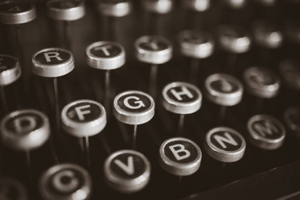 Vintage Typewritter Keyboard Selective focus image of a vintage typewriter keyboard typewriter keyboard stock pictures, royalty-free photos & images