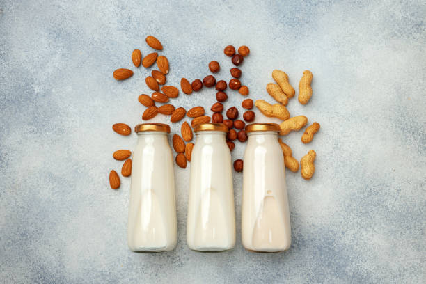 istock Vegan non dairy nut milk and heaps of different nuts top view 1303249285