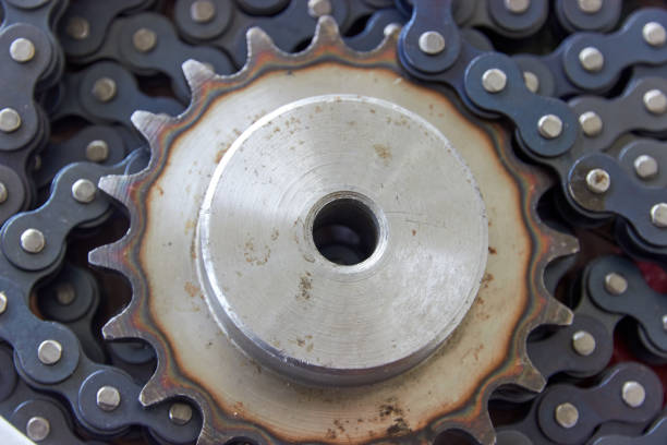 istock close up background of sprocket with hardened teeth and chain 1303249353