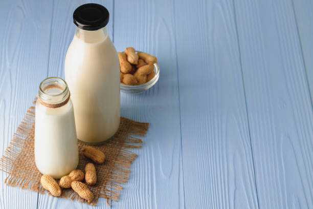 istock Vegan peanut milk in glass with peanuts 1303253450