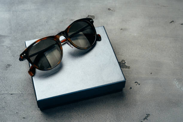istock Dark male sunglasses on grey concrete surface 1303253685