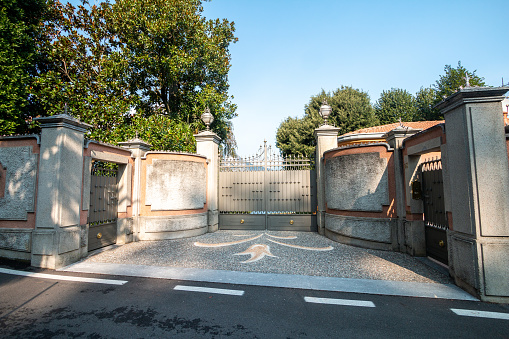 Driveway to a gated residence as seen from the public road in Bellagio on Lake Como in Lombardy, Italy