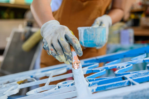 istock Painter woman painting for house improvement when lock down during Covid-19. 1303258459