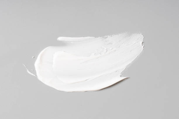istock white cosmetic face cream texture on white background 1303259104