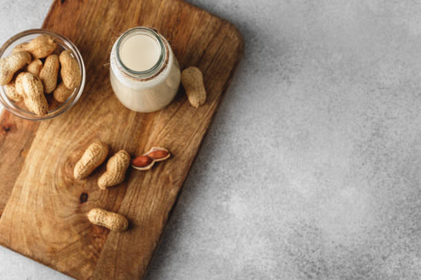 istock Vegan peanut milk in glass with peanuts 1303259862