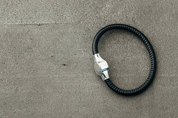 istock Metal key pendant on dark concrete background 1303260614