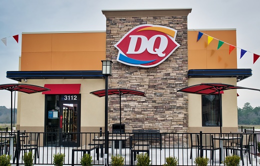 Houston, Texas USA 01-01-2020: Dairy Queen restaurant storefront in Houston, TX. Fast food chain store selling hot food and ice cream.