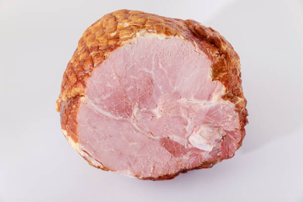 Tasty honey smoked pork ham on white background.