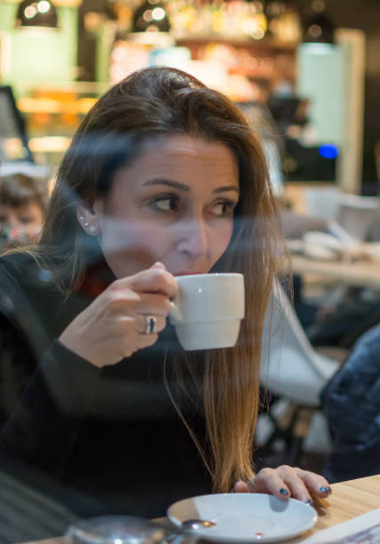 istock Woman In A Coffee Shop. 1303263469