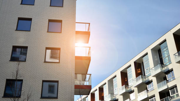 istock Modern apartment buildings on a sunny day with a blue sky. 1303267911
