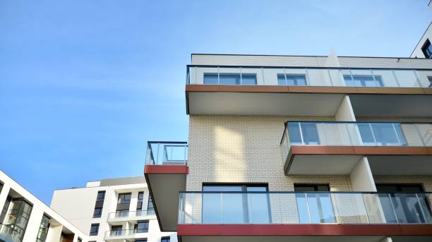 istock Modern apartment buildings on a sunny day with a blue sky. 1303268623