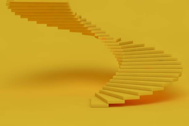 istock Yellow spiral staircase 1303272422