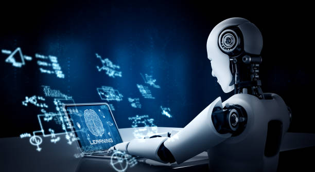 istock Robot humanoid use laptop and sit at table in concept of AI thinking brain 1303275659