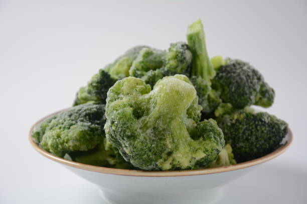 istock Small frozen  broccoli pieces 1303278413