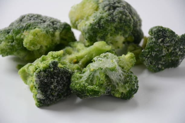 istock Small frozen  broccoli pieces 1303278456