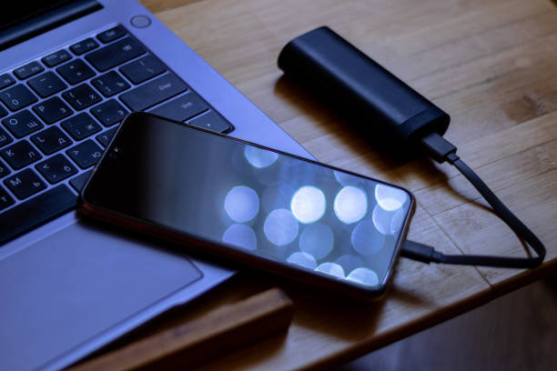 istock Phone is charged by the power bank 1303278476
