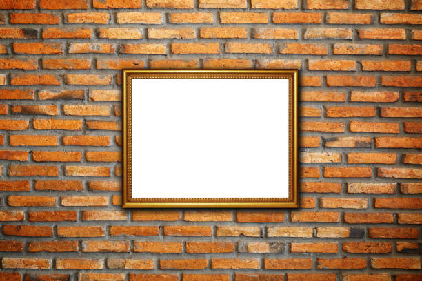 Gold vintage photo frame on red brick wall