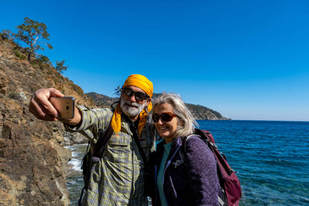 istock Hiker elderly couple taking selfie shots 1303281782